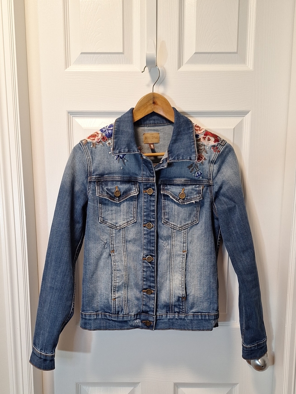Floral Embroidery Denim Jacket with Distressed Detailing.